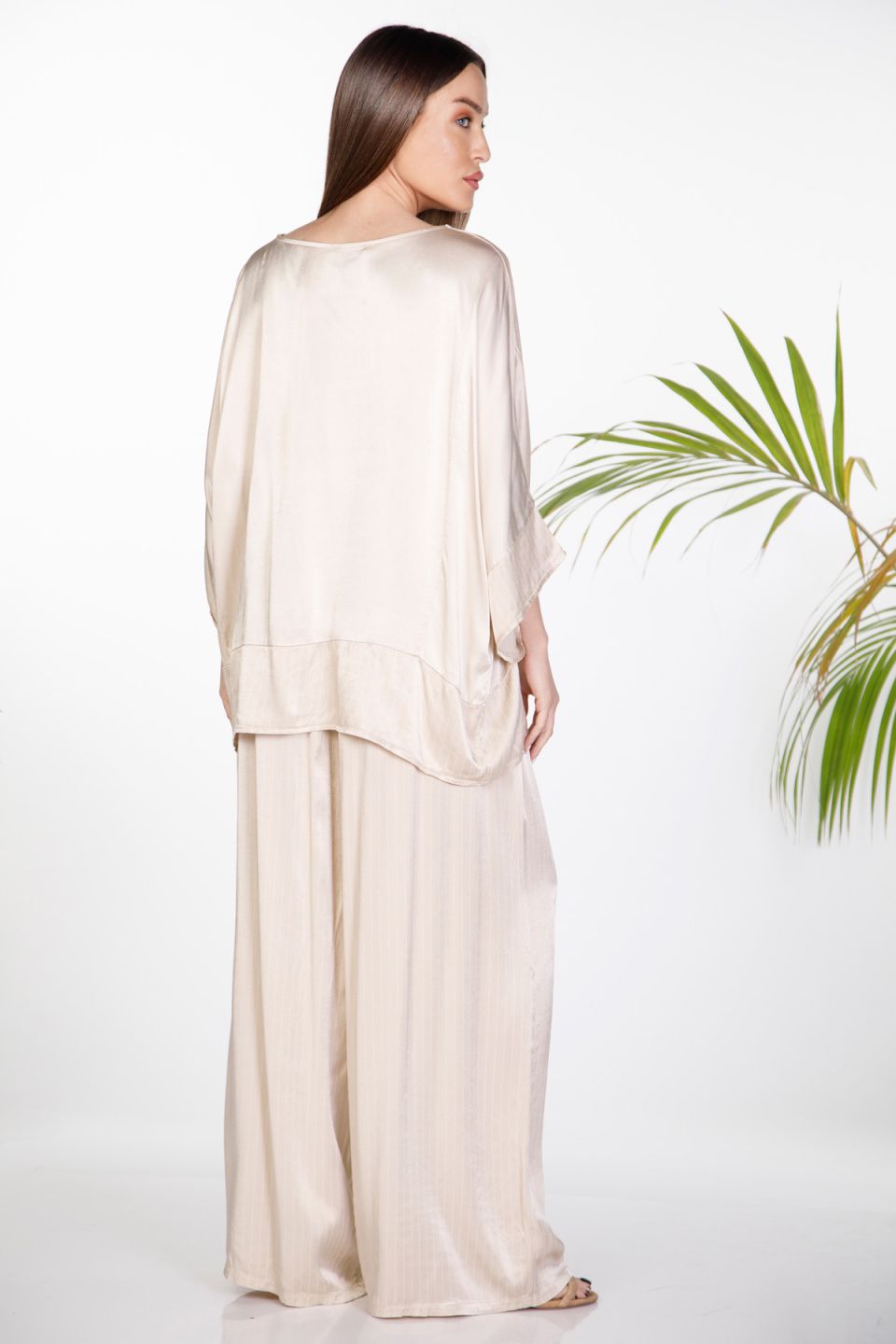 Oversize satin set with batwing sleeves & striped wide-leg trousers