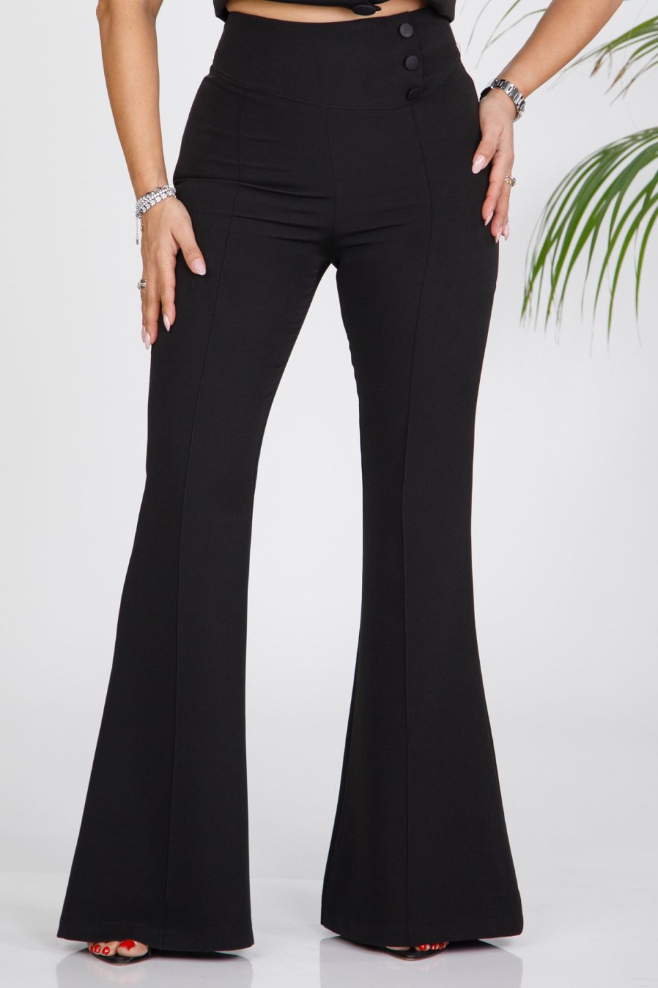 Flared trousers with waistband buttons
