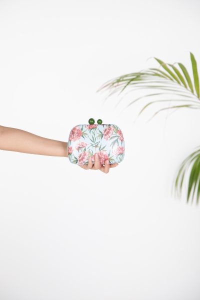 Evening clutch with floral embroidery and textured finish