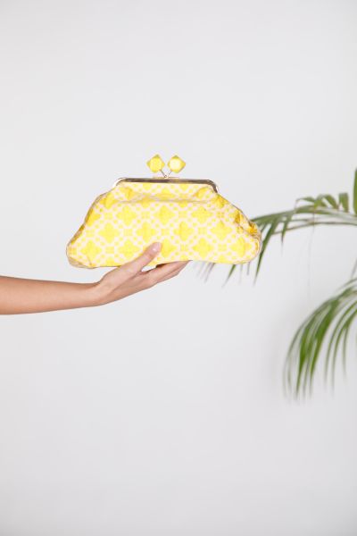 Embossed floral clutch bag