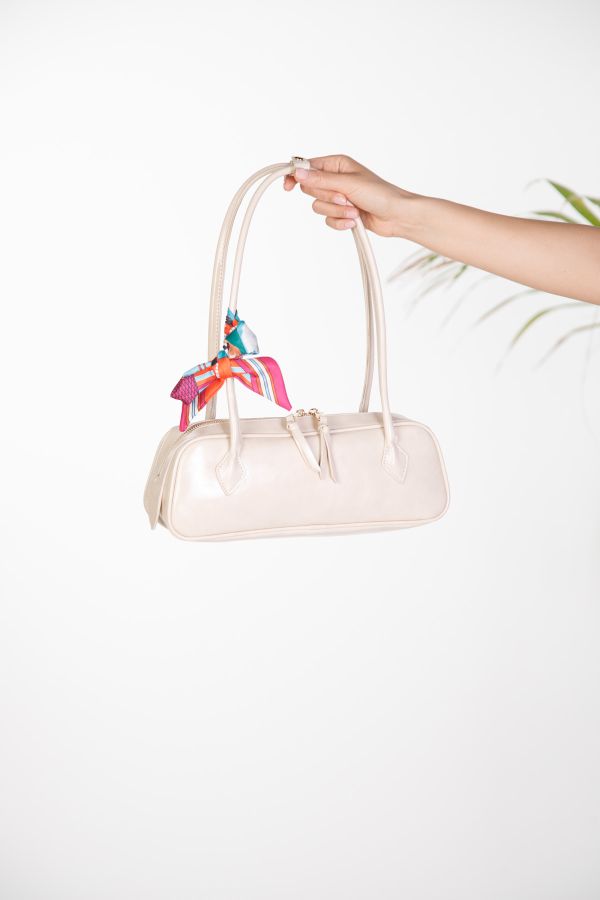 Elongated baguette shoulder bag with decorative scarf
