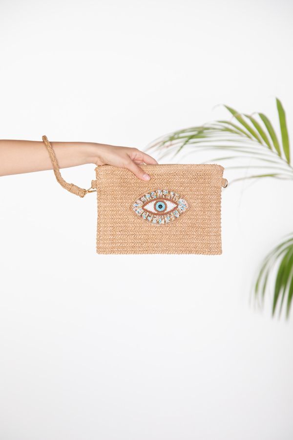 Straw clutch with embroidered eye