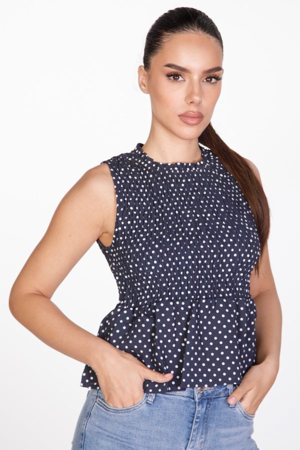 Sleeveless polka dot smocked top