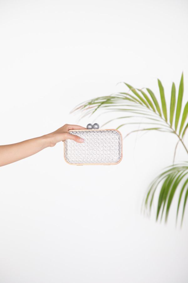 Evening clutch with textured weave and wooden frame