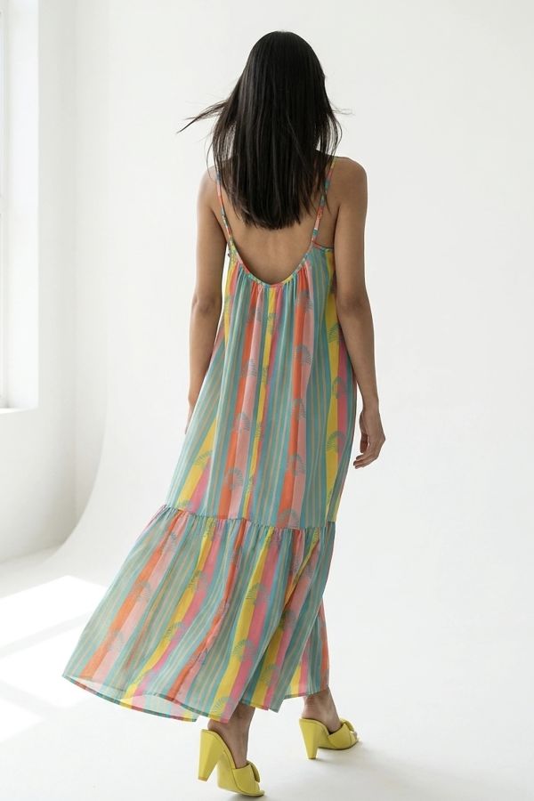 Vibrant striped maxi dress with fan motif and ruffle hem